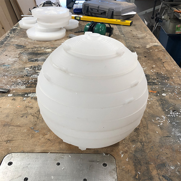 CNC cut acrylic layers assembled into sphere